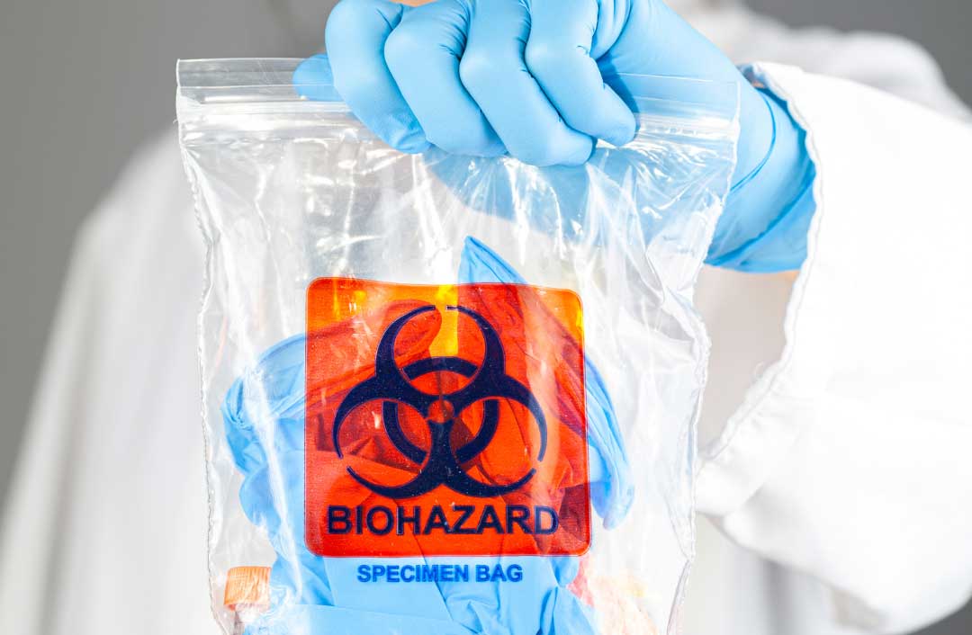 image of medical waste bag held by a doctor. Medsharps will assist you with disposing of your medical waste